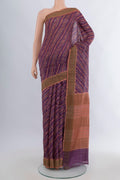 Mauve Tussar Saree with Floral Print on the body and Zari Border.  displayed on a mannequin