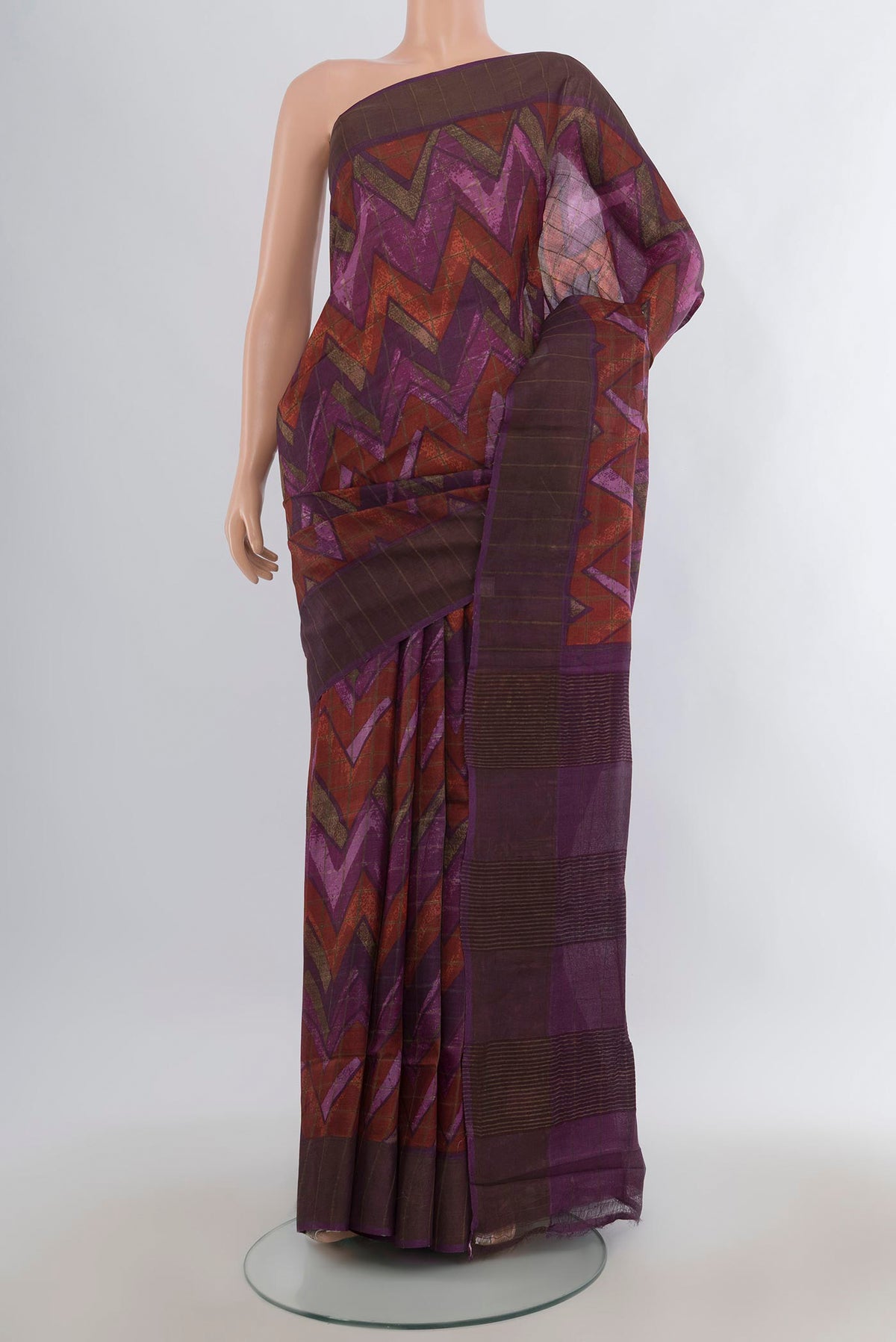 Purple Tussar Saree with Printed design on the body and Zari Border.  displayed on a mannequin