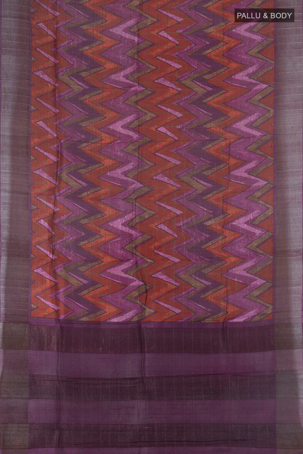 Flat view of Purple Tussar Saree with Printed design on the body and Zari Border. 