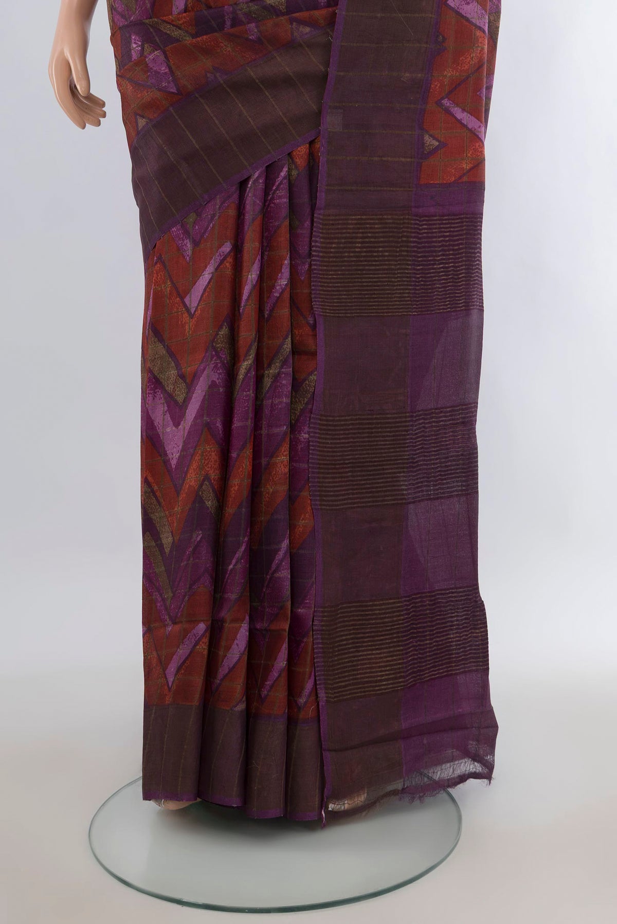 Pleats and pallu of Purple Tussar Saree with Printed design on the body and Zari Border. 