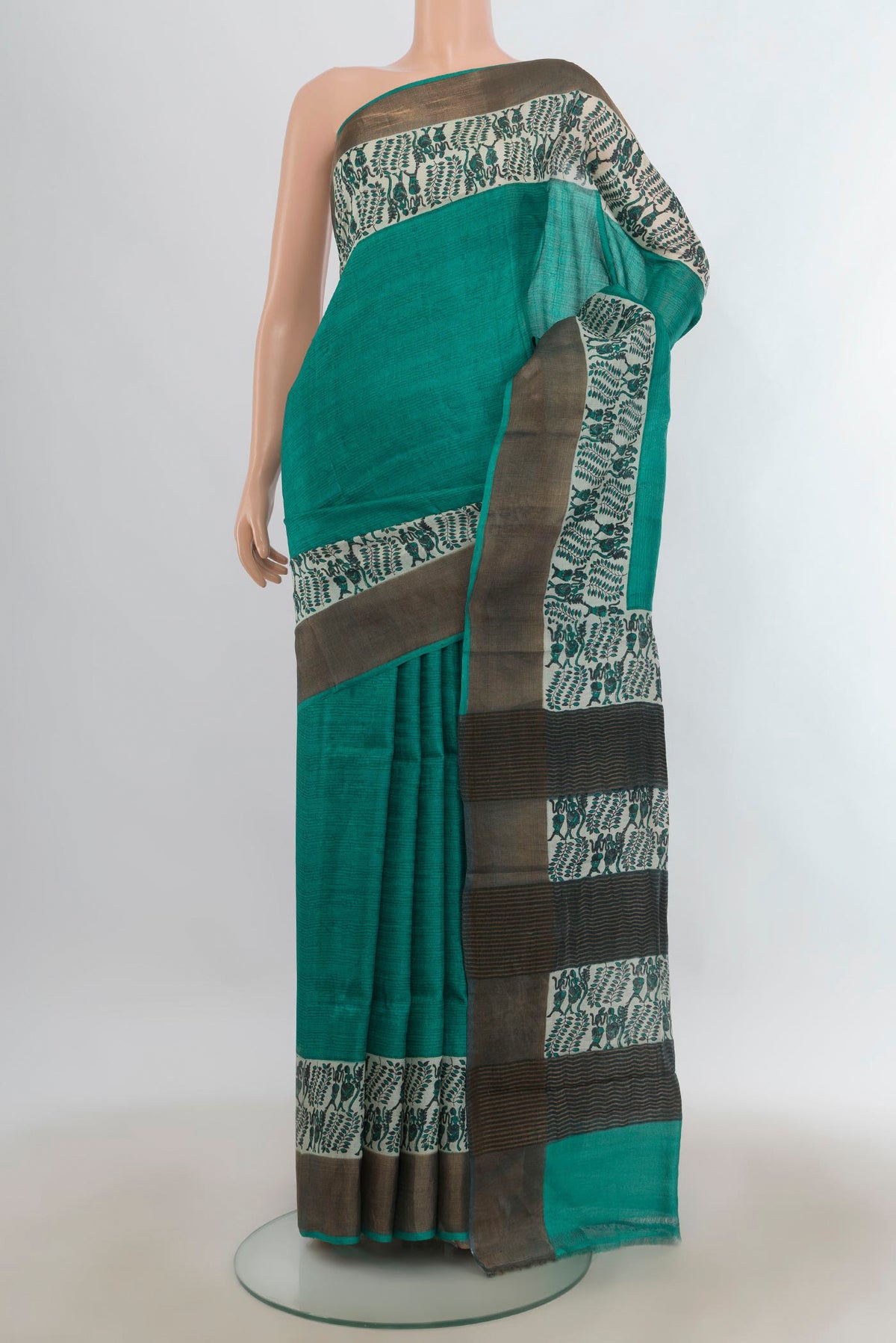 Turquoise Tussar Saree with Plain Body and Zari Border.  displayed on a mannequin