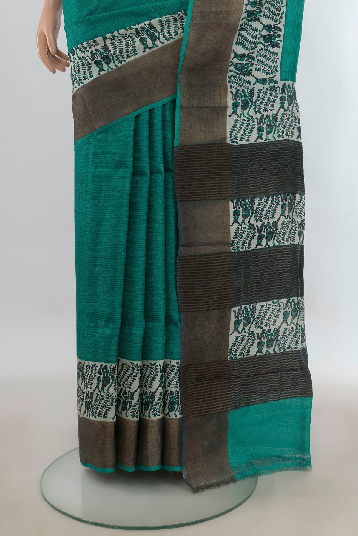 Pleats and pallu of Turquoise Tussar Saree with Plain Body and Zari Border. 