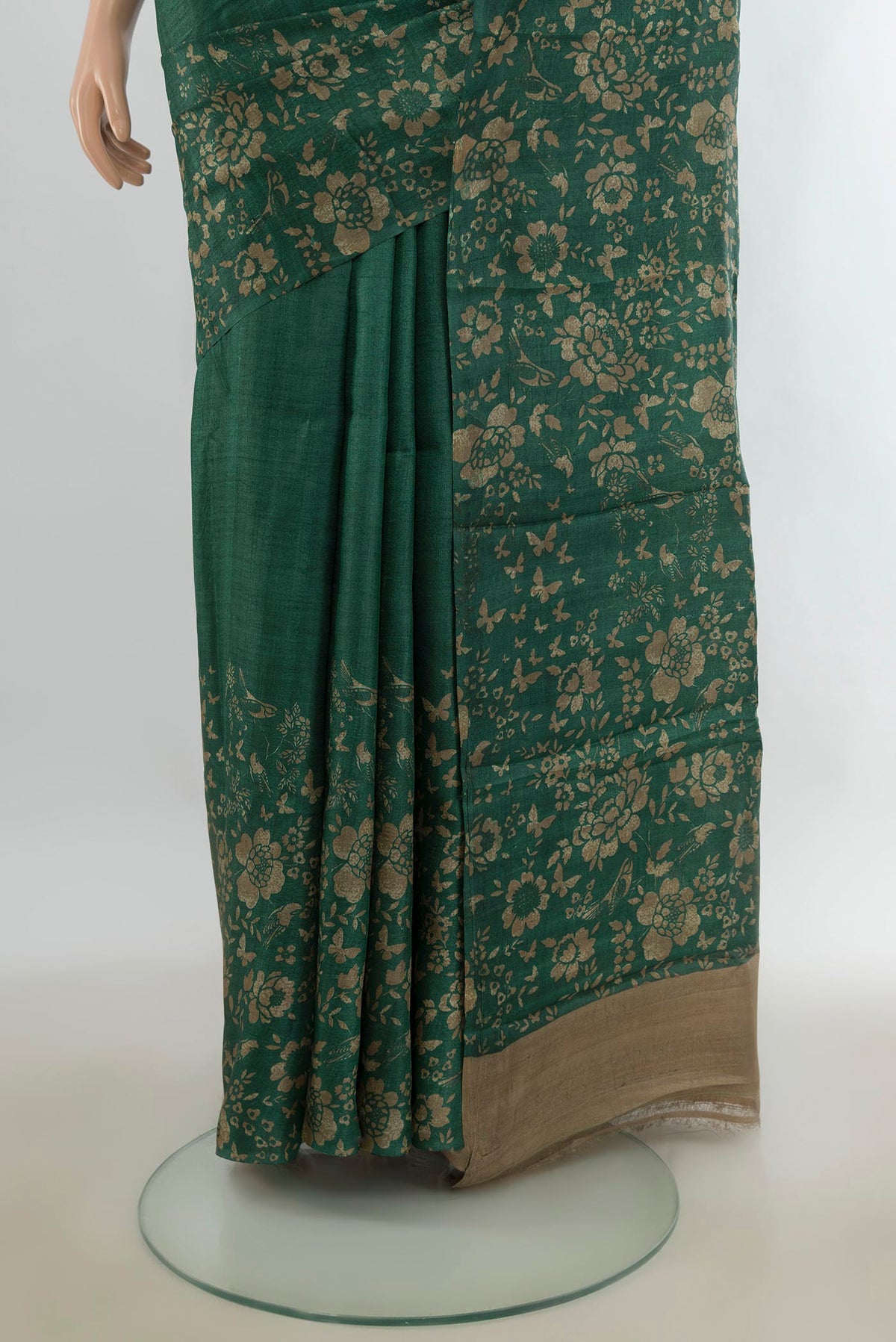Pleats and pallu of Bottle Green Tussar Saree with Plain Body and Without Border. 