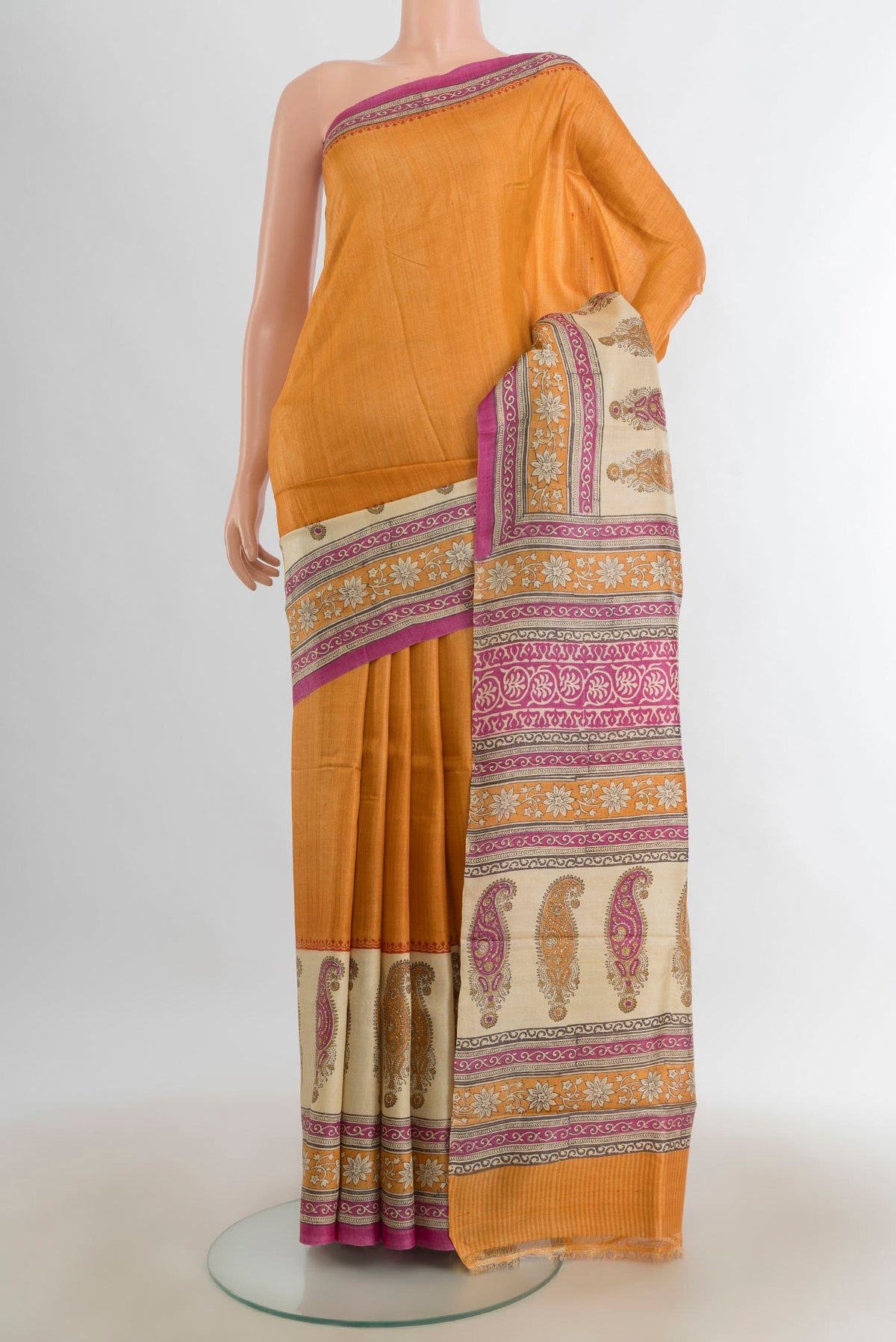 Multi Color Tussar Saree with Floral Print on the body and Silk Border.  displayed on a mannequin