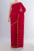 Pure Silk Red Kanchipuram Saree with Plain Body and Zari Border.  displayed on a mannequin