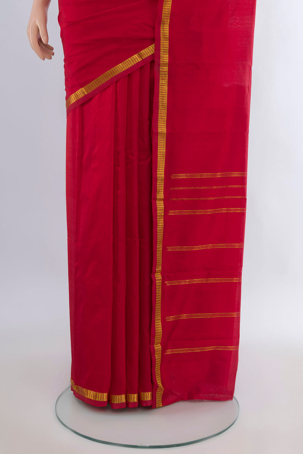 Pleats and pallu of Pure Silk Red Kanchipuram Saree with Plain Body and Zari Border. 