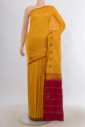 Pure Silk Mustard Kanjivaram Saree with Plain Body and Thread Border.  displayed on a mannequin