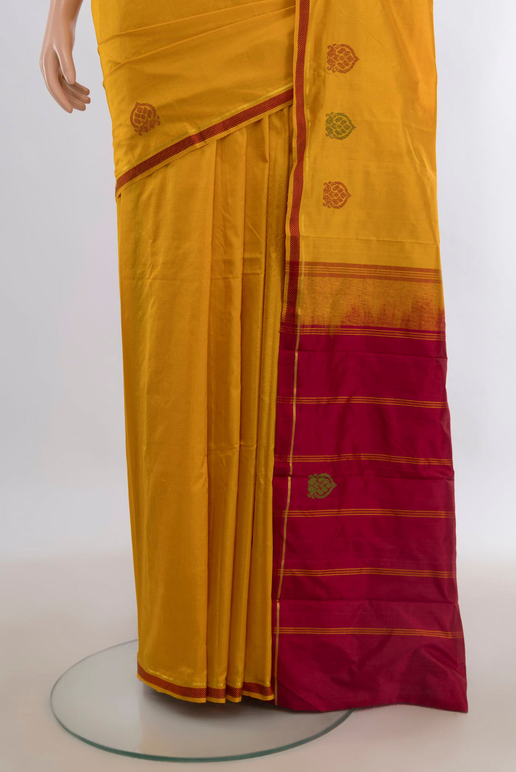 Pleats and pallu of Pure Silk Mustard Kanjivaram Saree with Plain Body and Thread Border. 