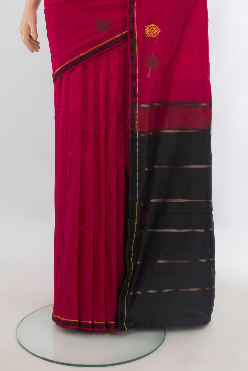 Pleats and pallu of Pure Silk Maroon Kanjivaram Saree with Plain Body and Zari And Thread Border. 