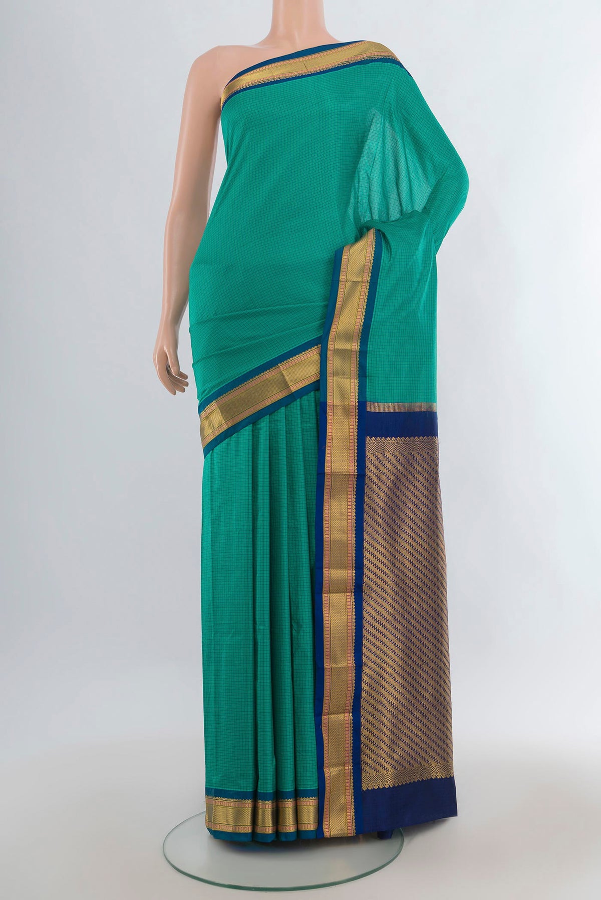 Pure Silk Green Narayanpet Saree with Checked design on the body and Zari Border.  displayed on a mannequin