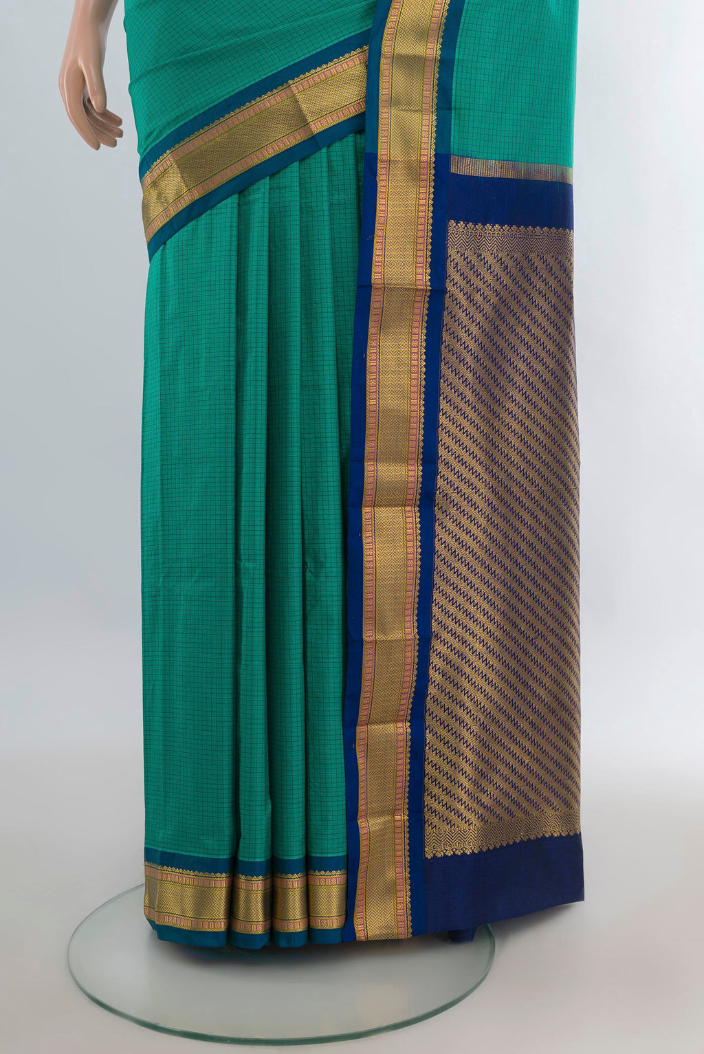 Pleats and pallu of Pure Silk Green Narayanpet Saree with Checked design on the body and Zari Border. 