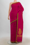 Pure Silk Dark Pink Kanchipuram Saree with Plain Body and Silk Border.  displayed on a mannequin