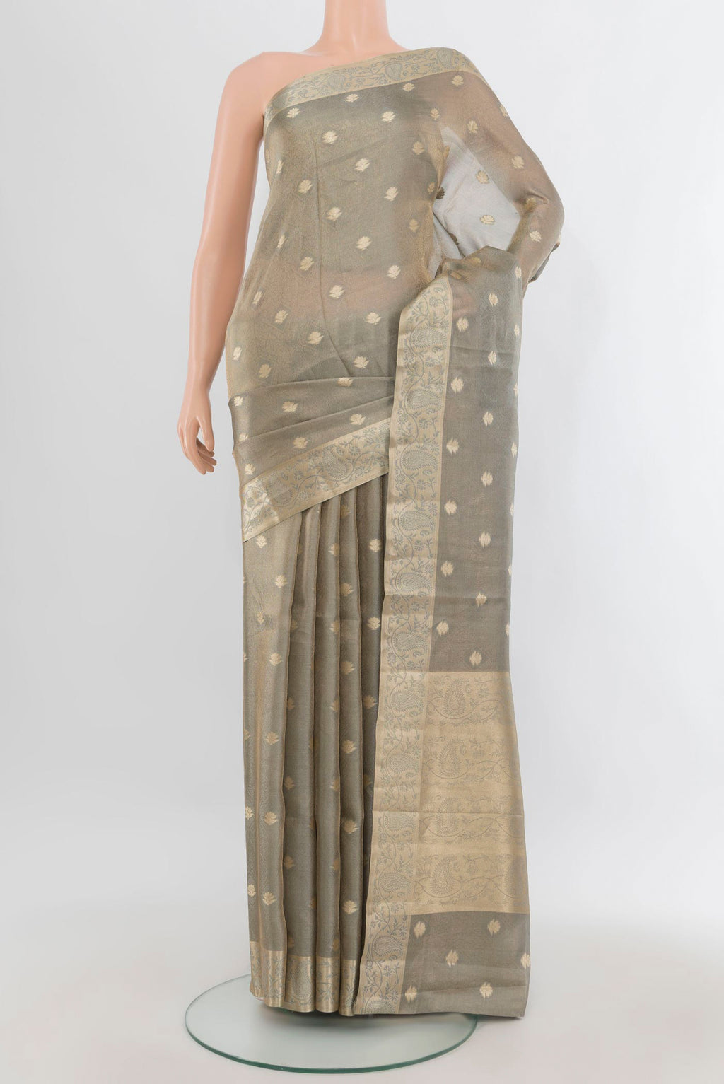 Grey Tissue Saree with Zari Butta on the body and Zari Border.  displayed on a mannequin