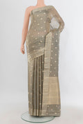 Grey Tissue Saree with Zari Butta on the body and Zari Border.  displayed on a mannequin