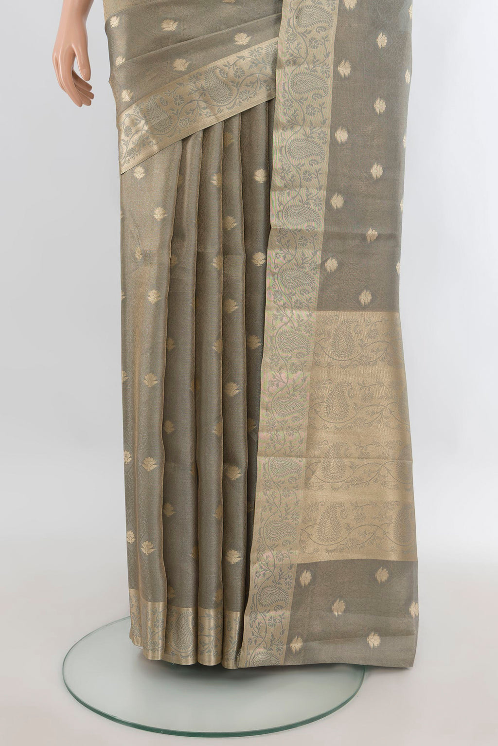 Pleats and pallu of Grey Tissue Saree with Zari Butta on the body and Zari Border. 