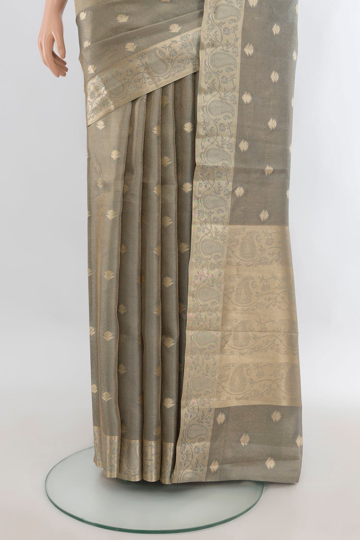 Pleats and pallu of Grey Tissue Saree with Zari Butta on the body and Zari Border. 