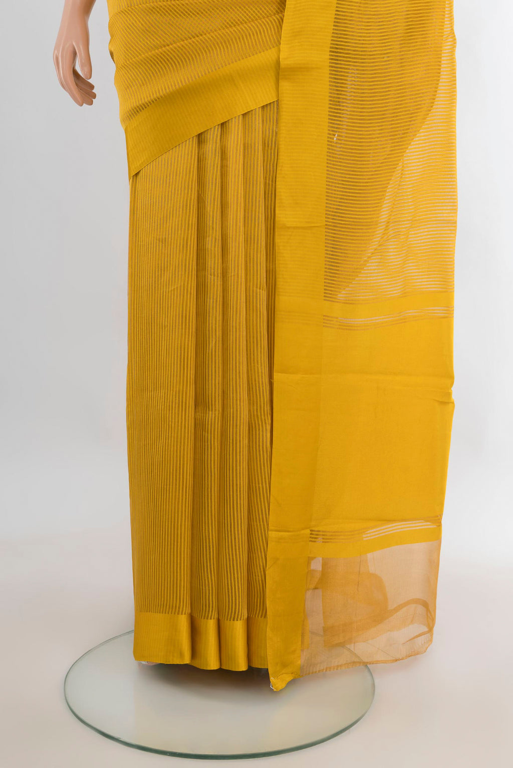 Pleats and pallu of Mustard Tussar Saree with Stripes on the body and Satin Border. 