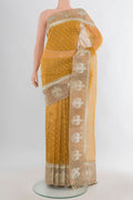 Golden Tussar Saree with Zari Butta on the body and Zari Border.  displayed on a mannequin