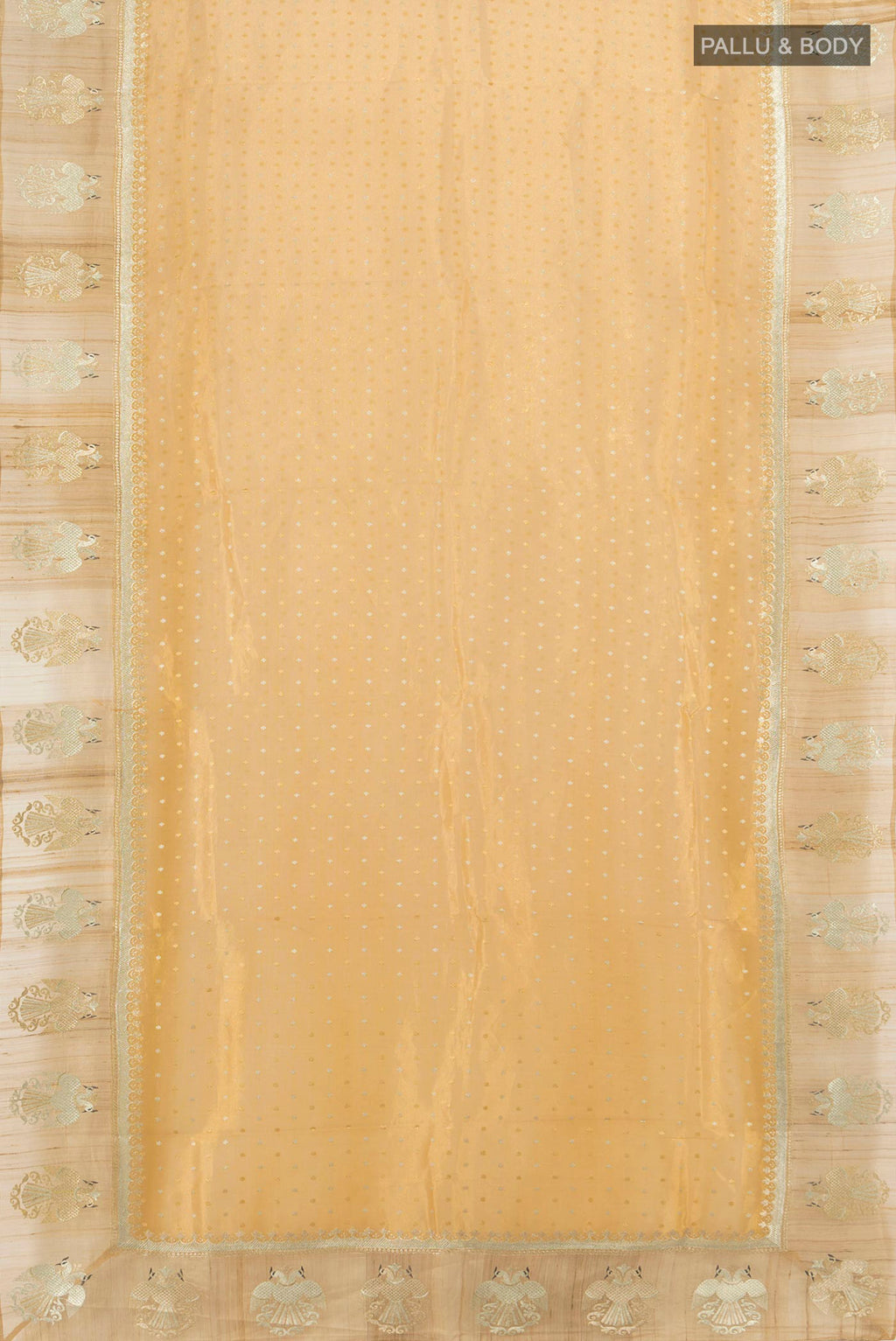 Flat view of Golden Tussar Saree with Zari Butta on the body and Zari Border. 