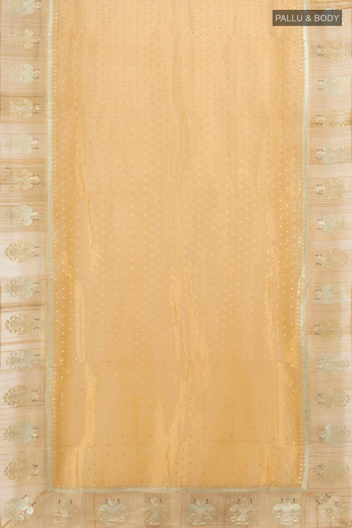Flat view of Golden Tussar Saree with Zari Butta on the body and Zari Border. 