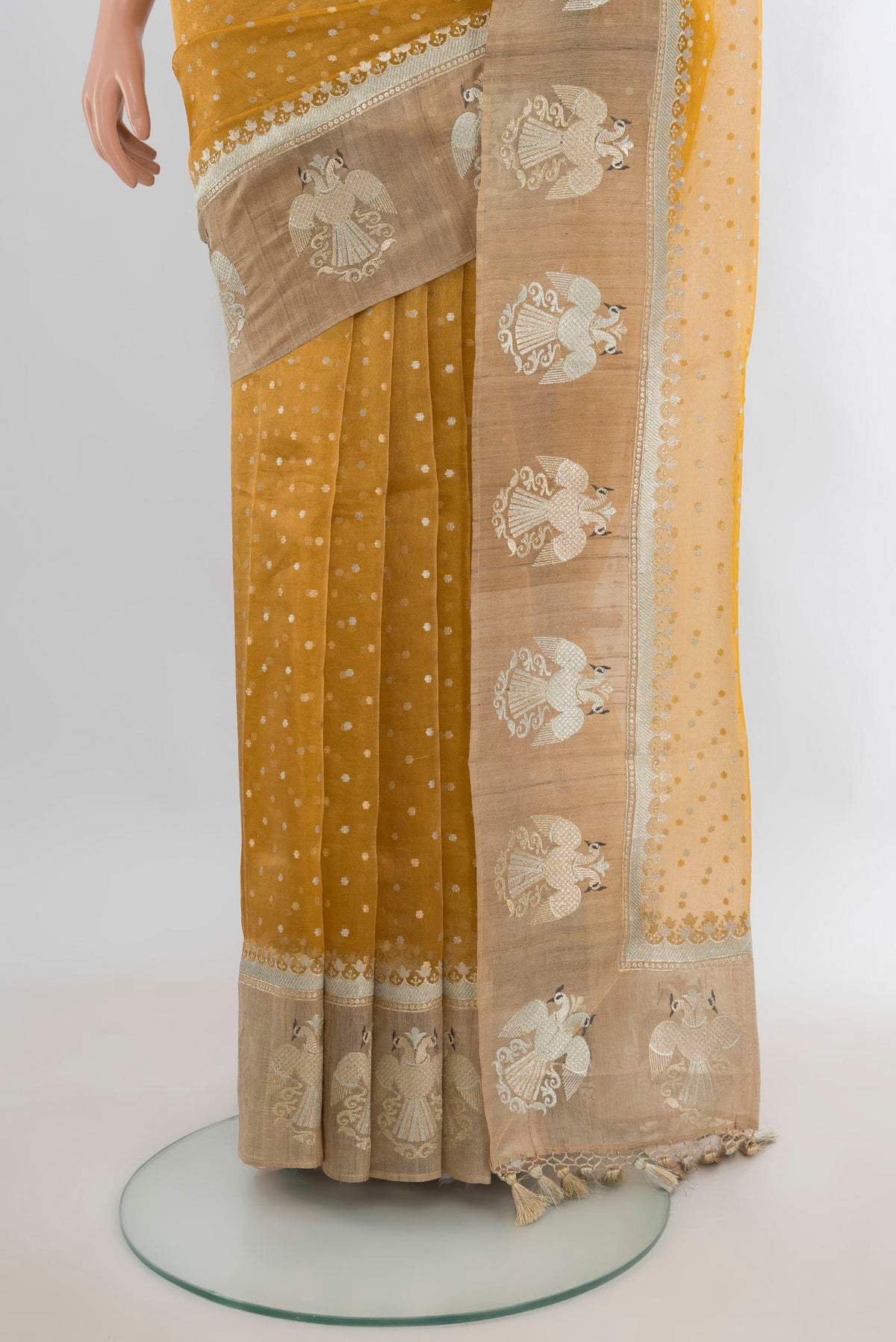 Pleats and pallu of Golden Tussar Saree with Zari Butta on the body and Zari Border. 