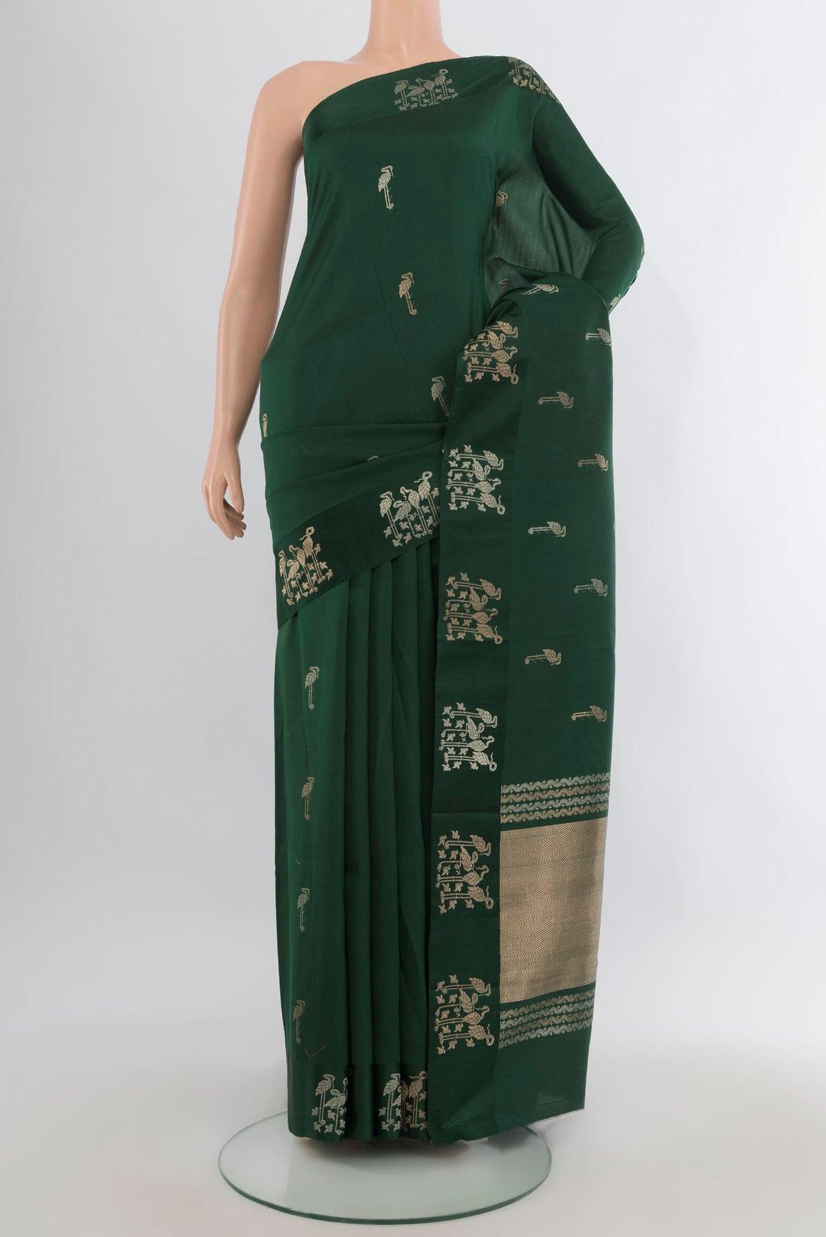 Pure Silk Bottle Green Banarasi Katan Saree with Zari Butta on the body and Plain Border.  displayed on a mannequin