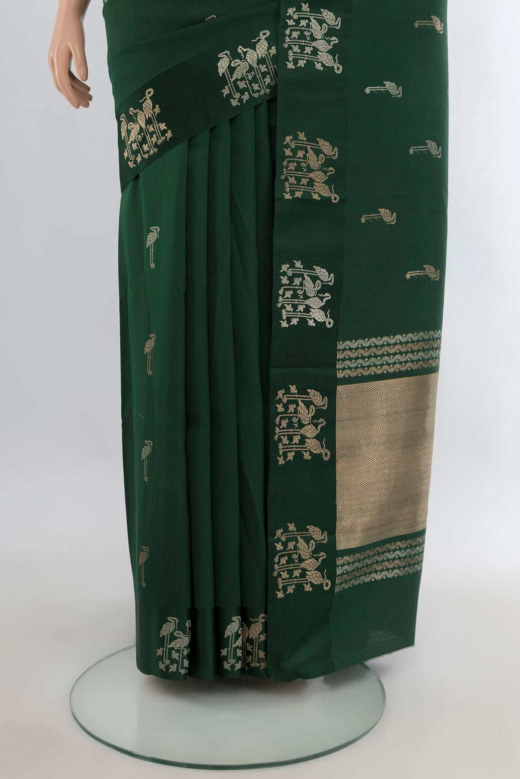 Pleats and pallu of Pure Silk Bottle Green Banarasi Katan Saree with Zari Butta on the body and Plain Border. 
