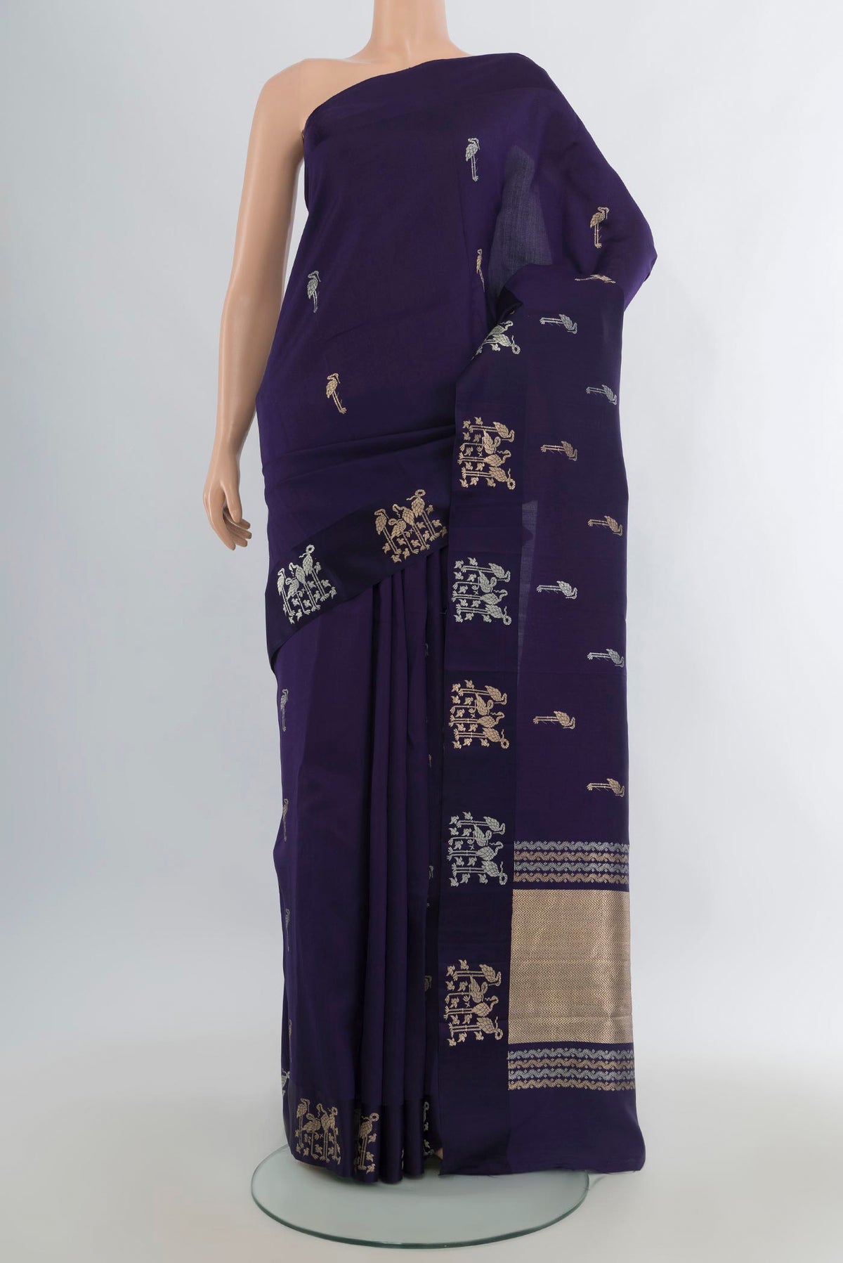 Pure Silk Navy Blue Banarasi Katan Saree with Zari Butta on the body and Plain Border.  displayed on a mannequin