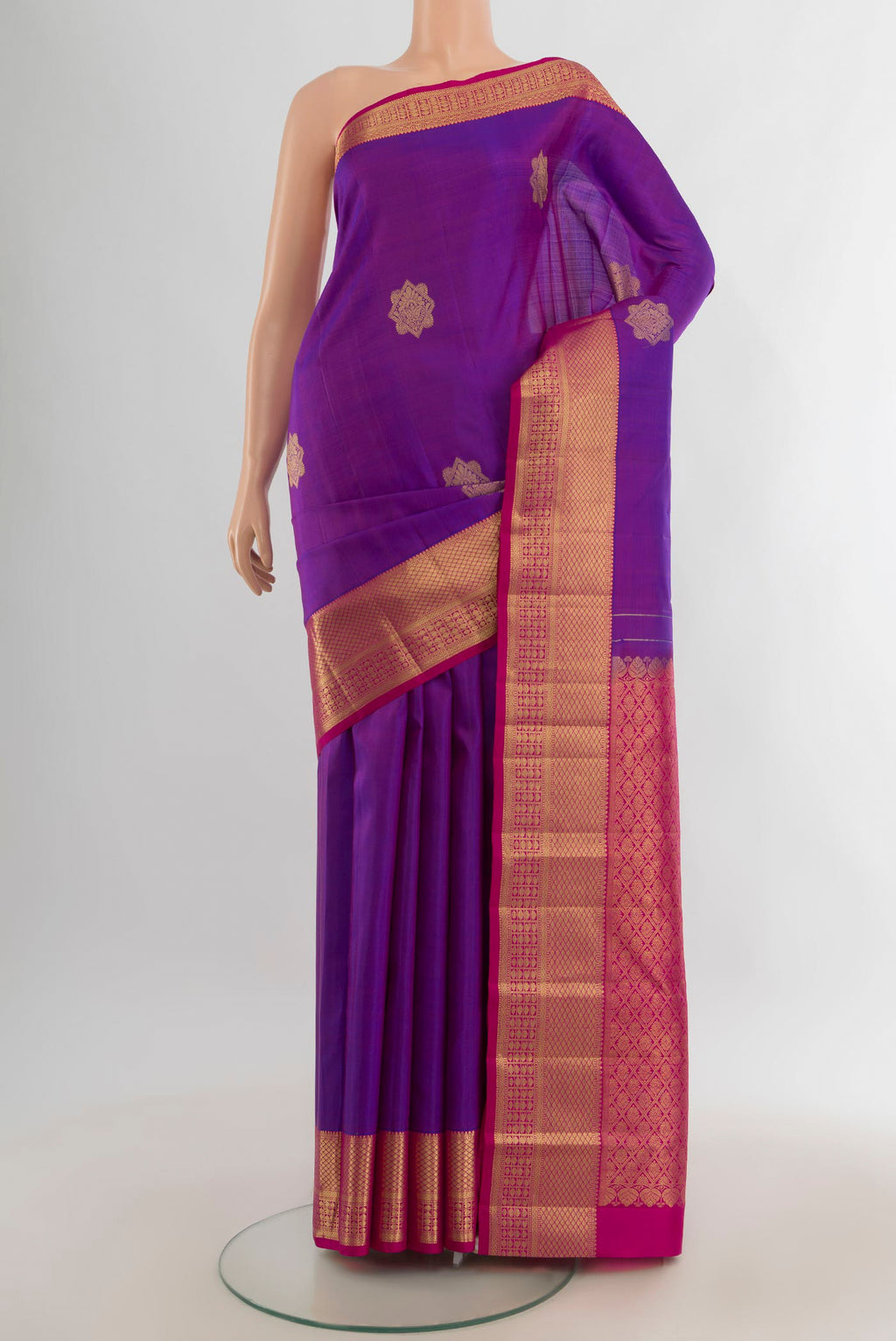 Pure Silk Purple Kanchipuram Saree with Zari Butta on the body and Zari Border.  displayed on a mannequin