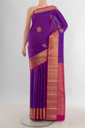 Pure Silk Purple Kanchipuram Saree with Zari Butta on the body and Zari Border.  displayed on a mannequin