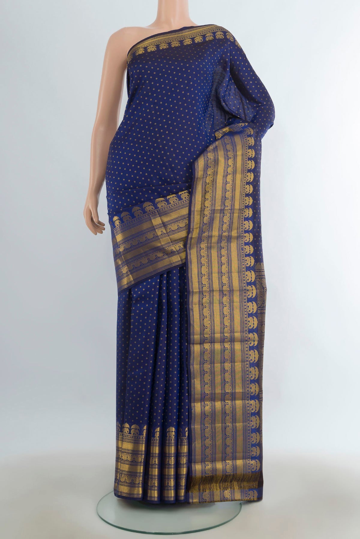 Pure Silk Navy Blue Kanjivaram Saree with Zari Butta on the body and Silk Border.  displayed on a mannequin