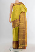Golden Dual Tone Kanchipuram Tissue Saree with Zari Butta on the body and Zari Border.  displayed on a mannequin