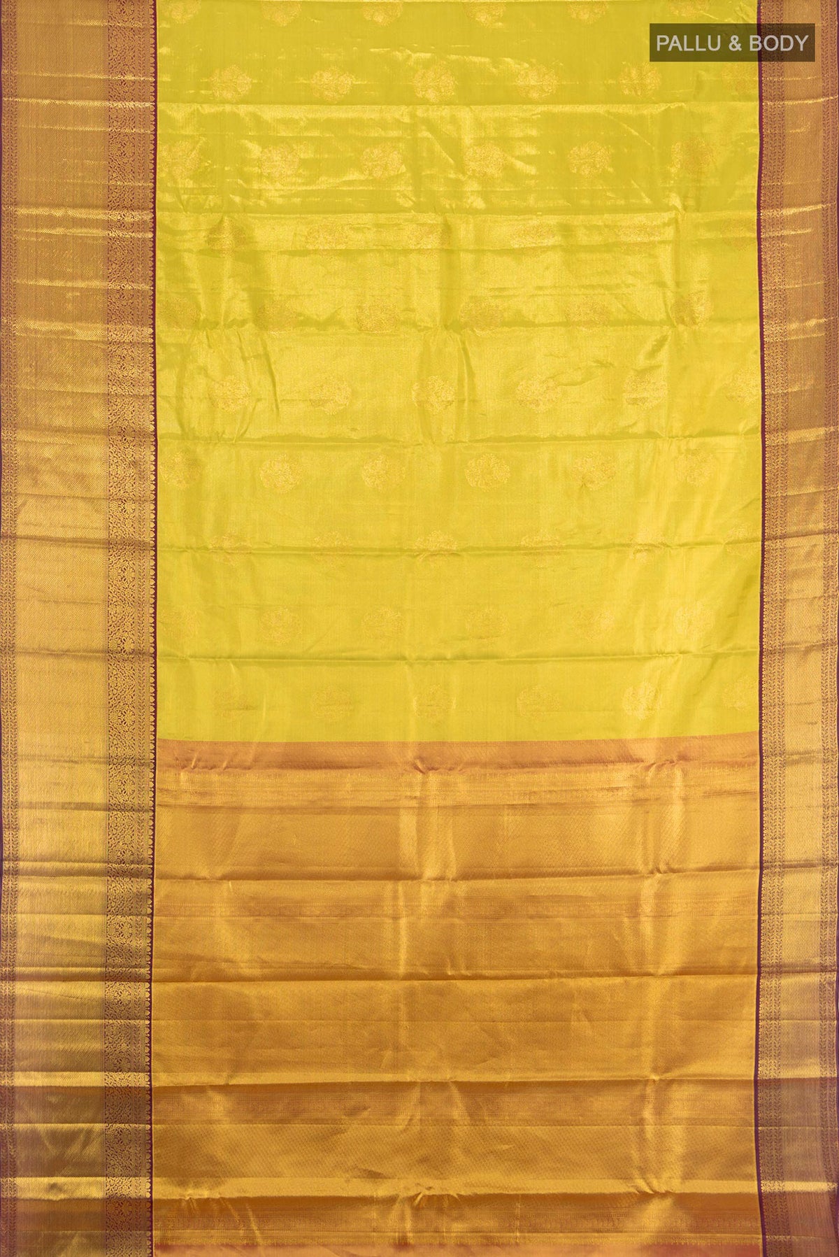 Flat view of Golden Dual Tone Kanchipuram Tissue Saree with Zari Butta on the body and Zari Border. 