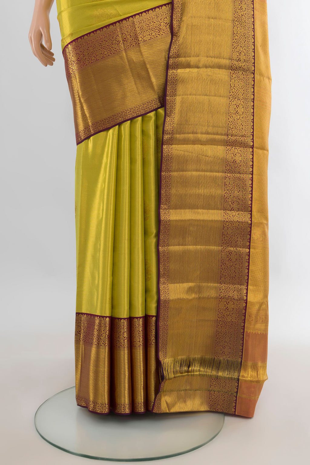 Pleats and pallu of Golden Dual Tone Kanchipuram Tissue Saree with Zari Butta on the body and Zari Border. 