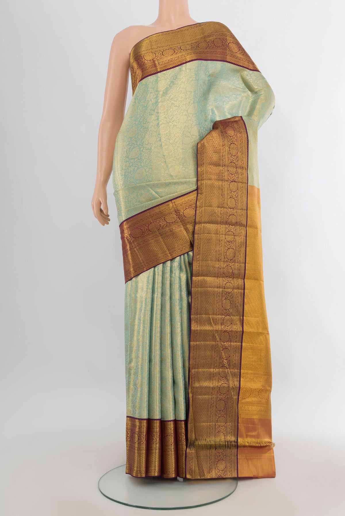 Light Green Dual Tone Kanjivaram Tissue Saree with Zari Brocade on the body and Zari Border.  displayed on a mannequin