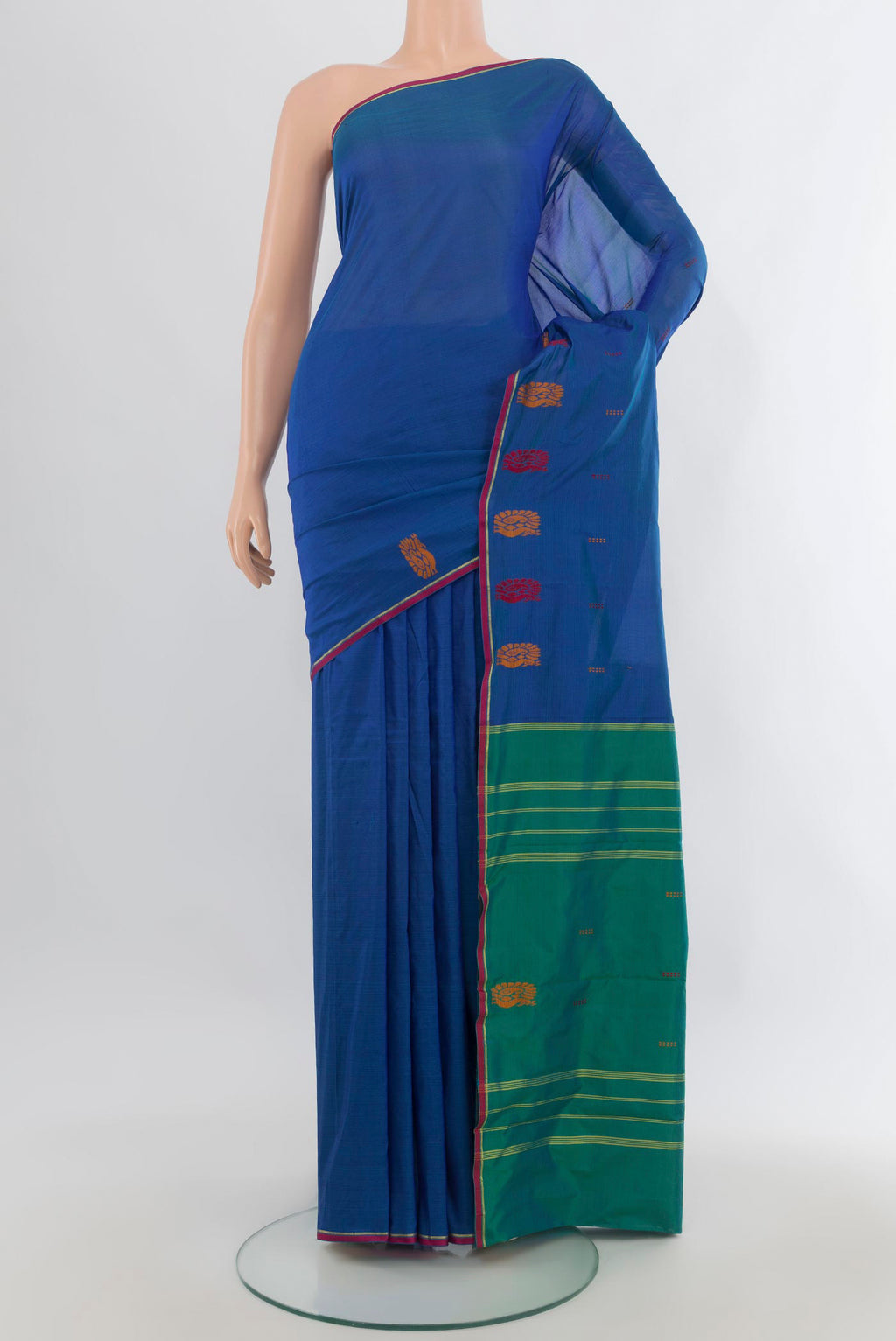 Pure Silk Blue Kanchipuram Saree with Plain Body and Zari And Thread Border.  displayed on a mannequin