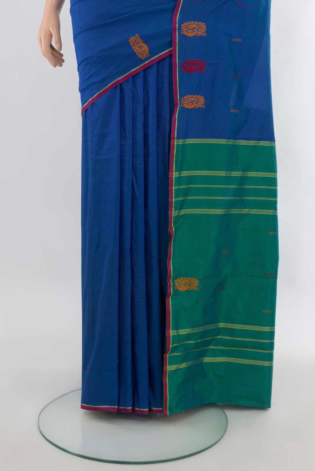 Pleats and pallu of Pure Silk Blue Kanchipuram Saree with Plain Body and Zari And Thread Border. 
