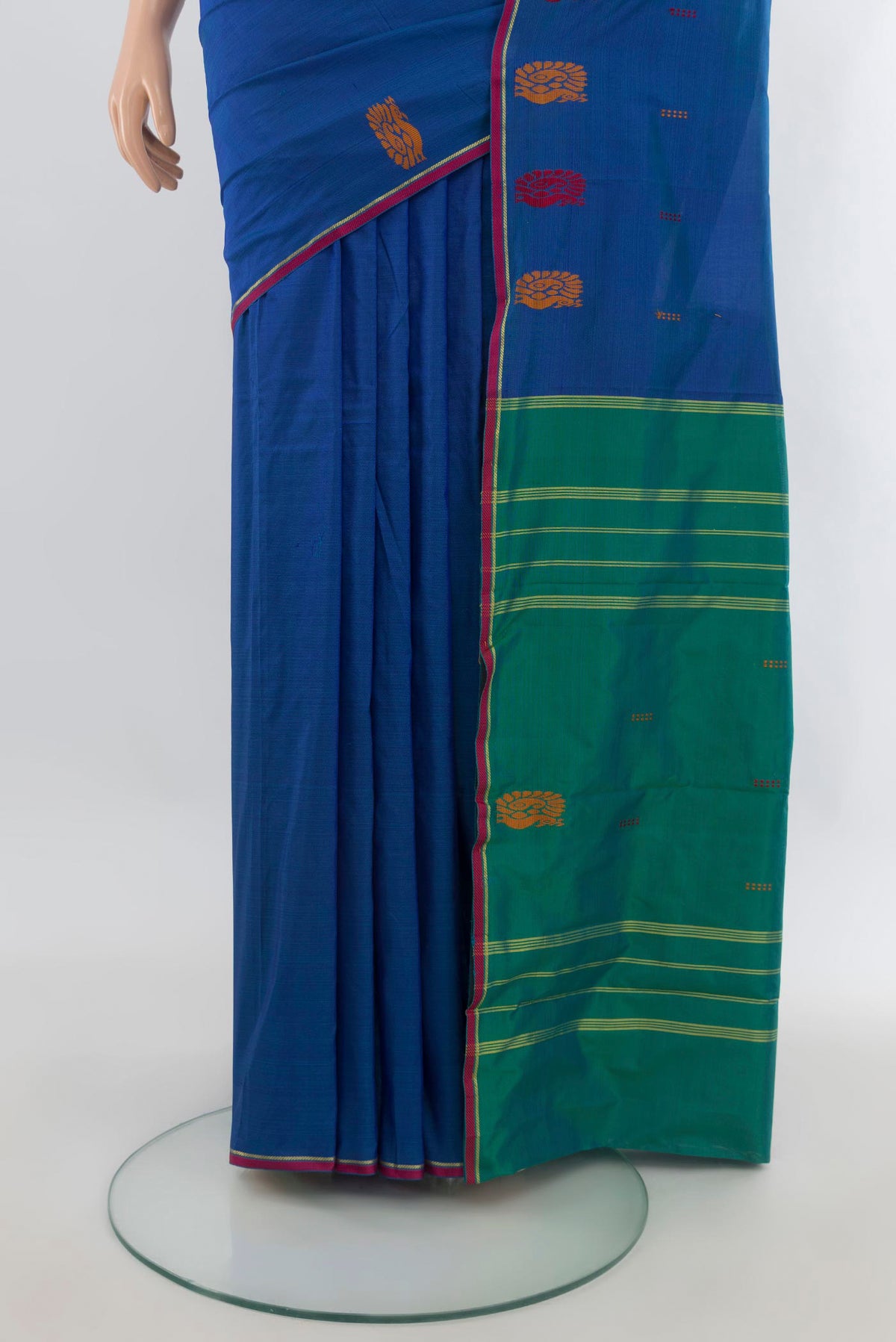 Pleats and pallu of Pure Silk Blue Kanchipuram Saree with Plain Body and Zari And Thread Border. 