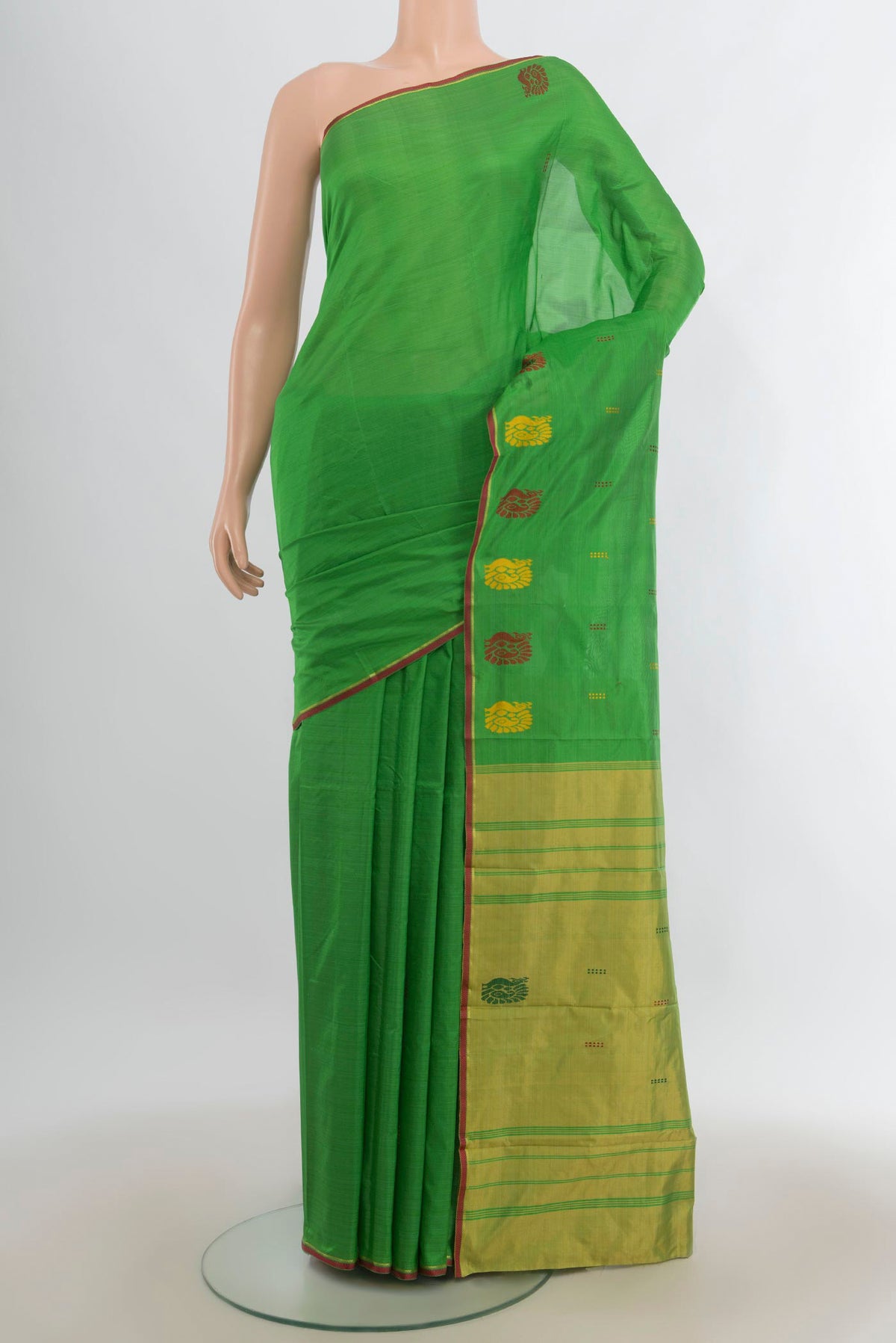 Pure Silk Green Kanchipuram Saree with Plain Body and Thread Border.  displayed on a mannequin