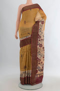 Mustard Tussar Saree with Floral Print on the body and Zari Border.  displayed on a mannequin