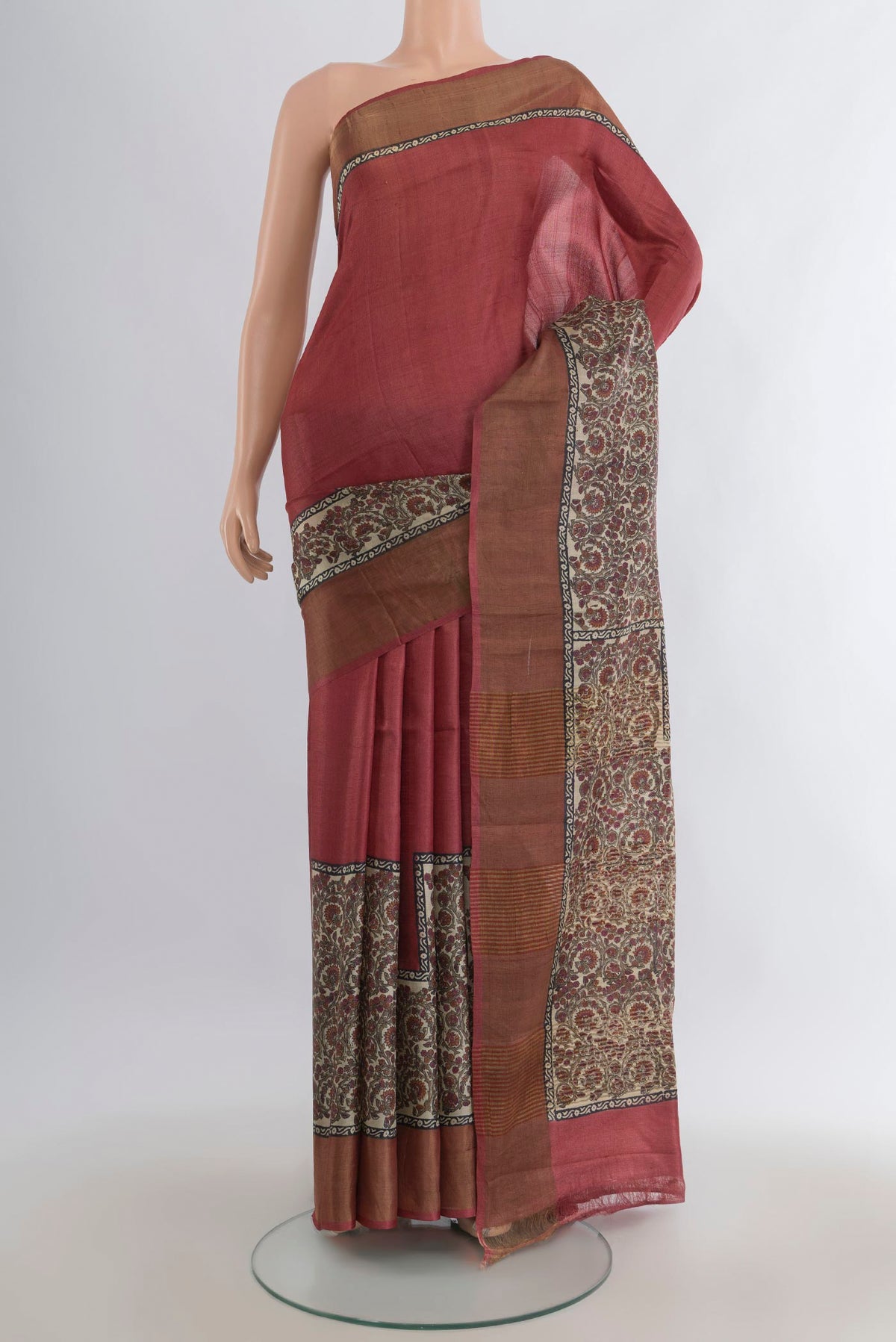 Rust Tussar Saree with Plain Body and Zari Border.  displayed on a mannequin