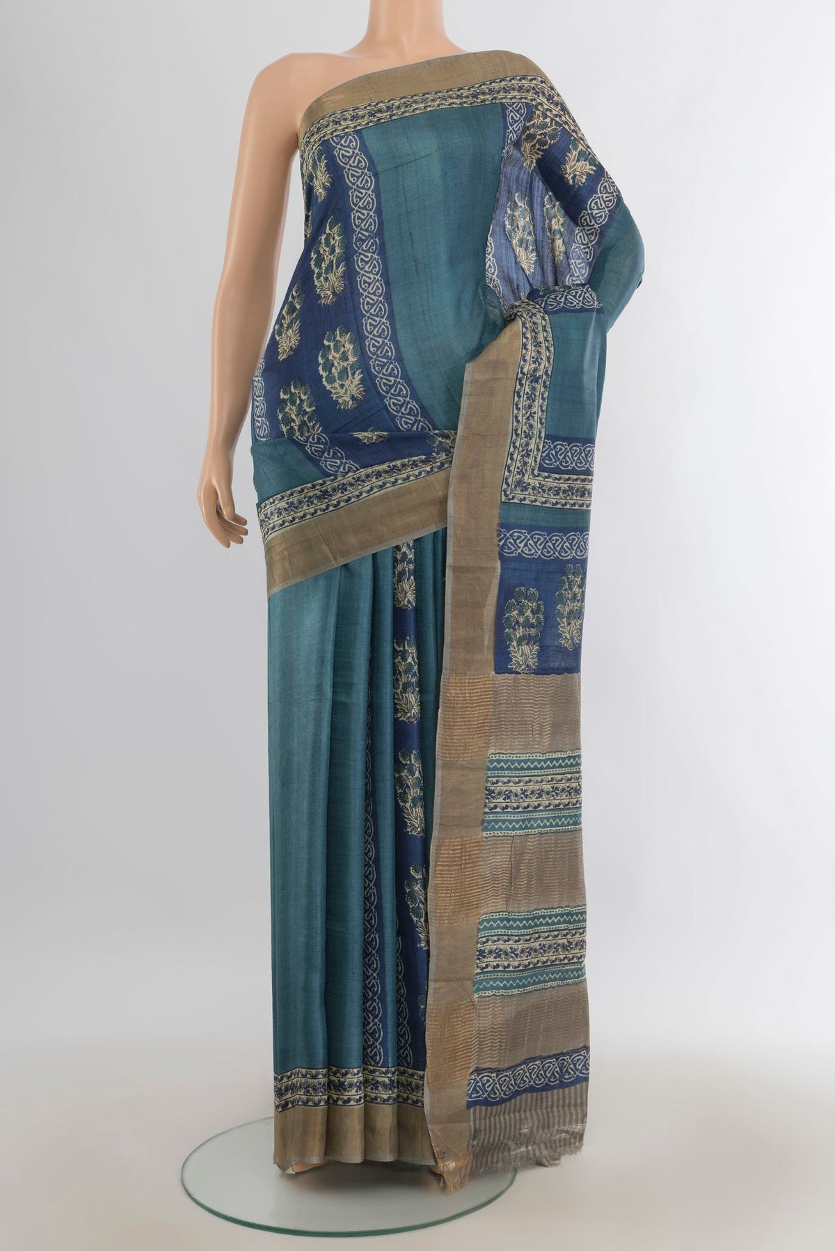 Multi Color Tussar Saree with Floral Print on the body and Silk Border.  displayed on a mannequin