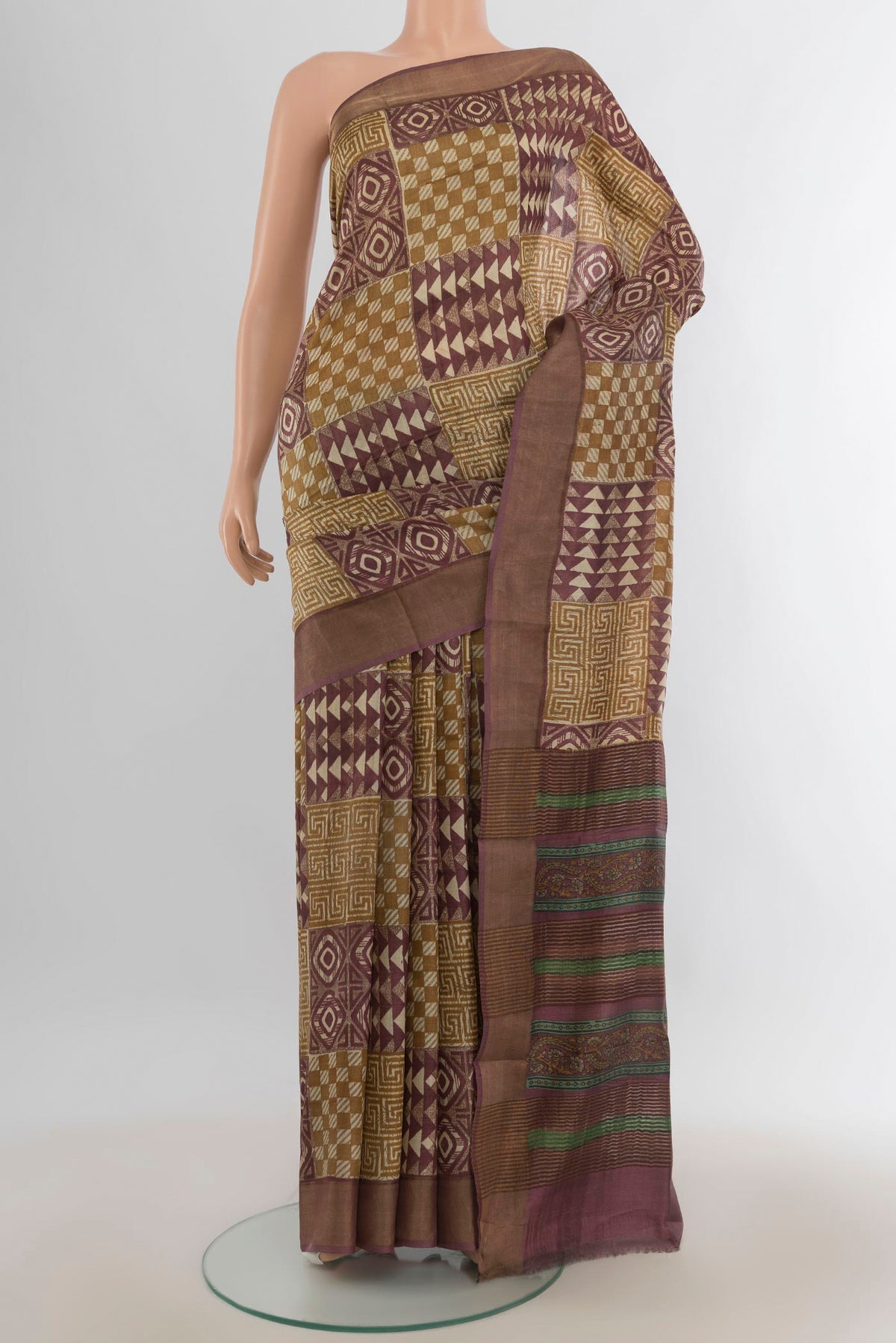 Multi Color Tussar Saree with Floral Print on the body and Silk Border.  displayed on a mannequin