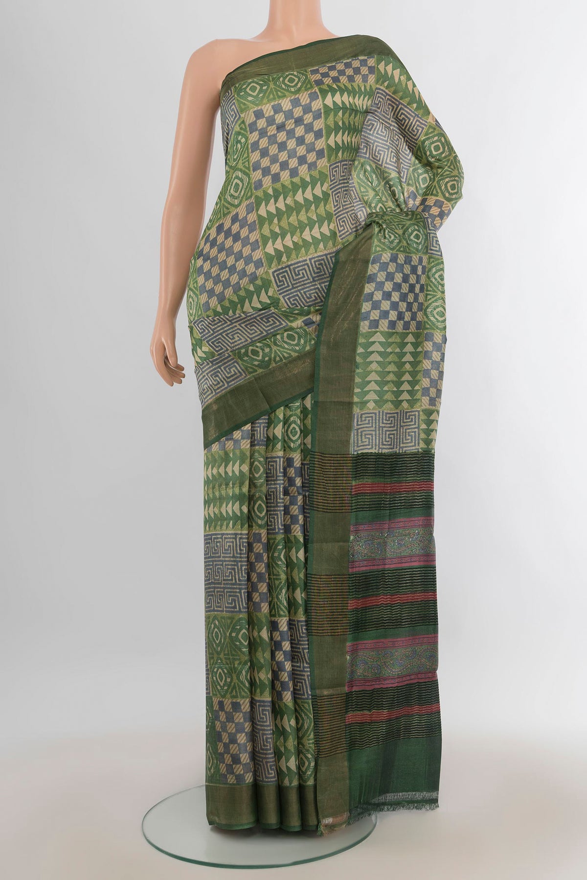 Multi Color Tussar Saree with Floral Print on the body and Silk Border.  displayed on a mannequin