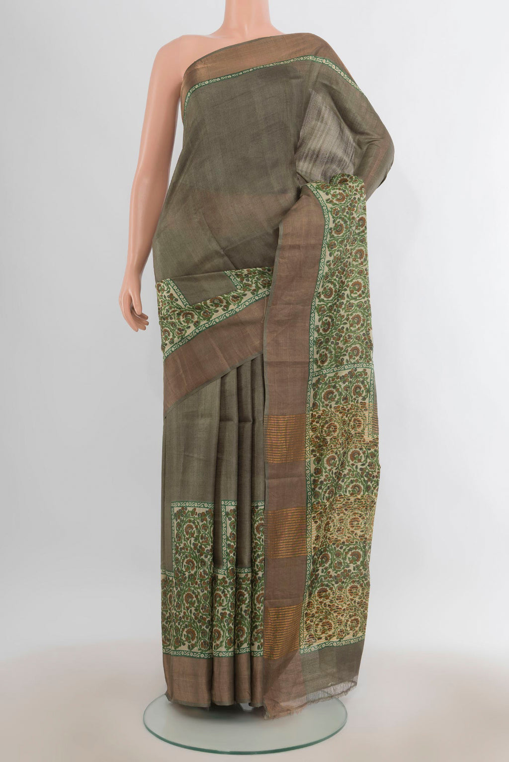 Green Tussar Saree with Plain Body and Zari Border.  displayed on a mannequin