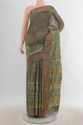 Green Tussar Saree with Plain Body and Zari Border.  displayed on a mannequin
