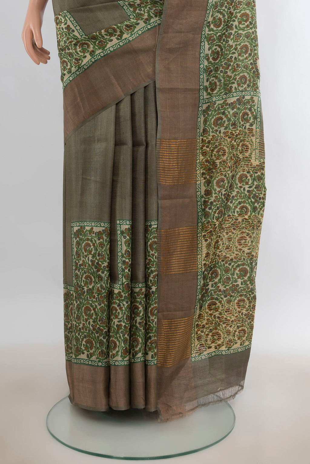 Pleats and pallu of Green Tussar Saree with Plain Body and Zari Border. 