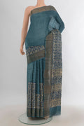 Multi Color Tussar Saree with Floral Print on the body and Silk Border.  displayed on a mannequin