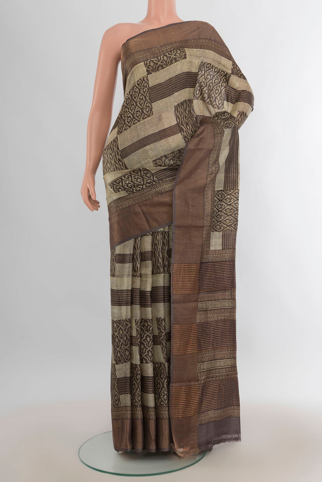 Multi Color Tussar Saree with Floral Print on the body and Silk Border.  displayed on a mannequin