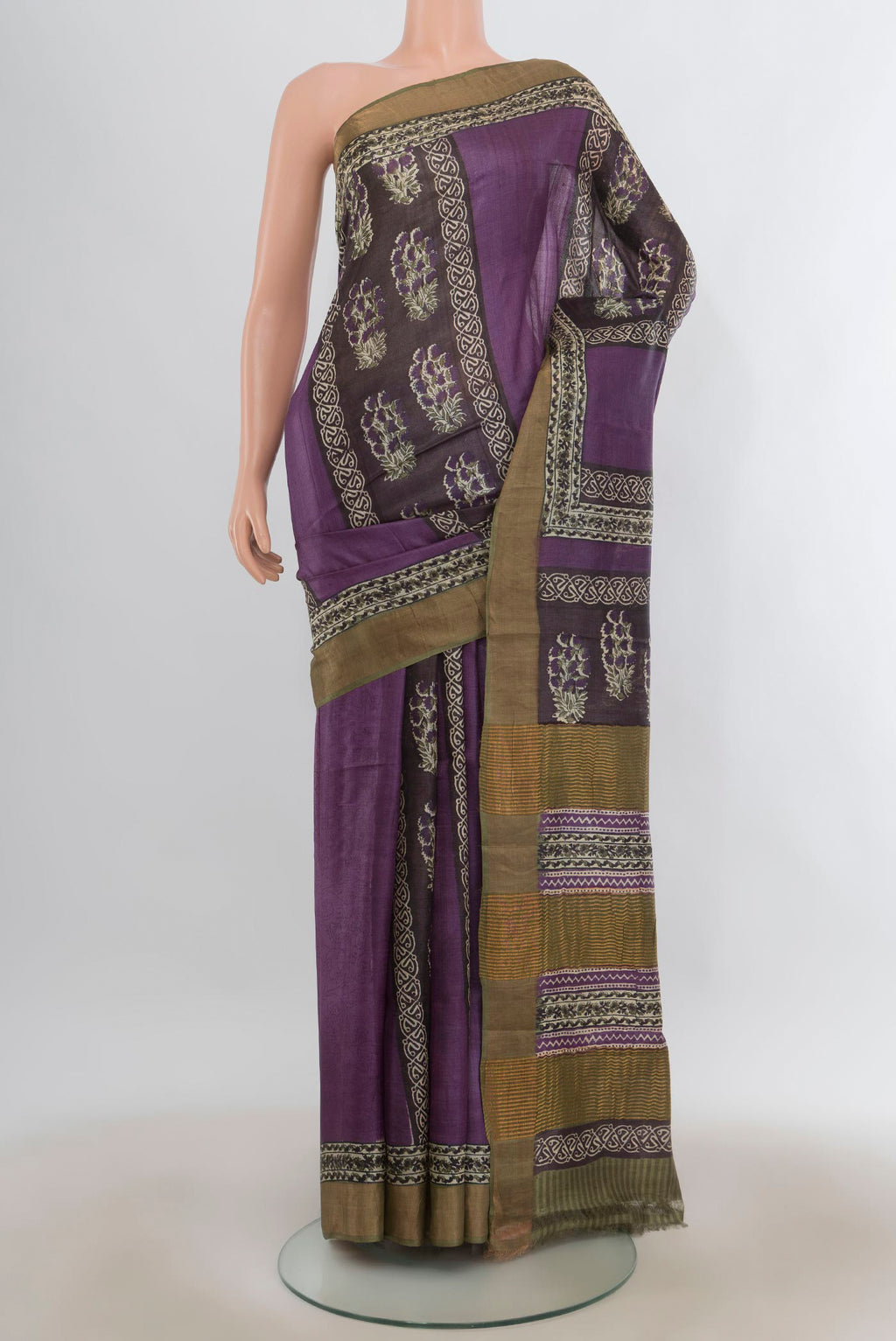 Purple Tussar Saree with Printed design on the body and Zari Border.  displayed on a mannequin